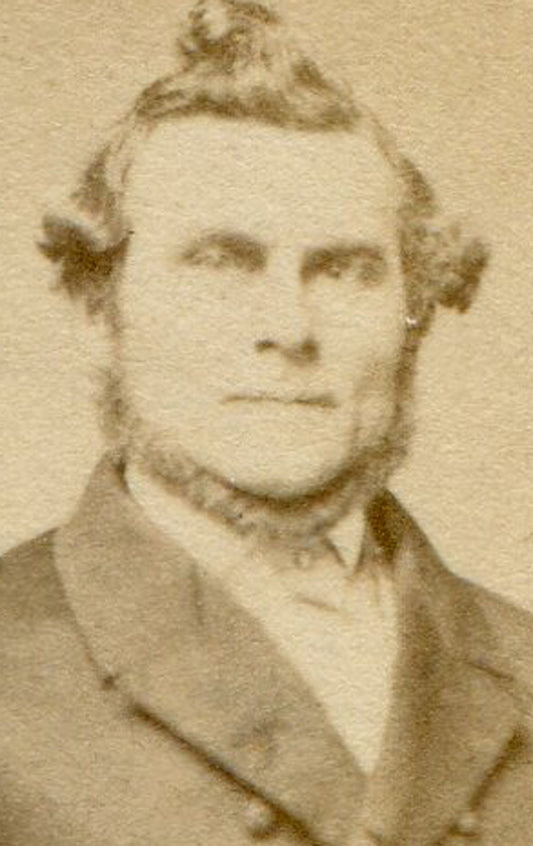 BEARDED MAN WITH CUPIE DOLL HAIR, NAPOLEON POSE HOLDING TOP HAT. CDV.