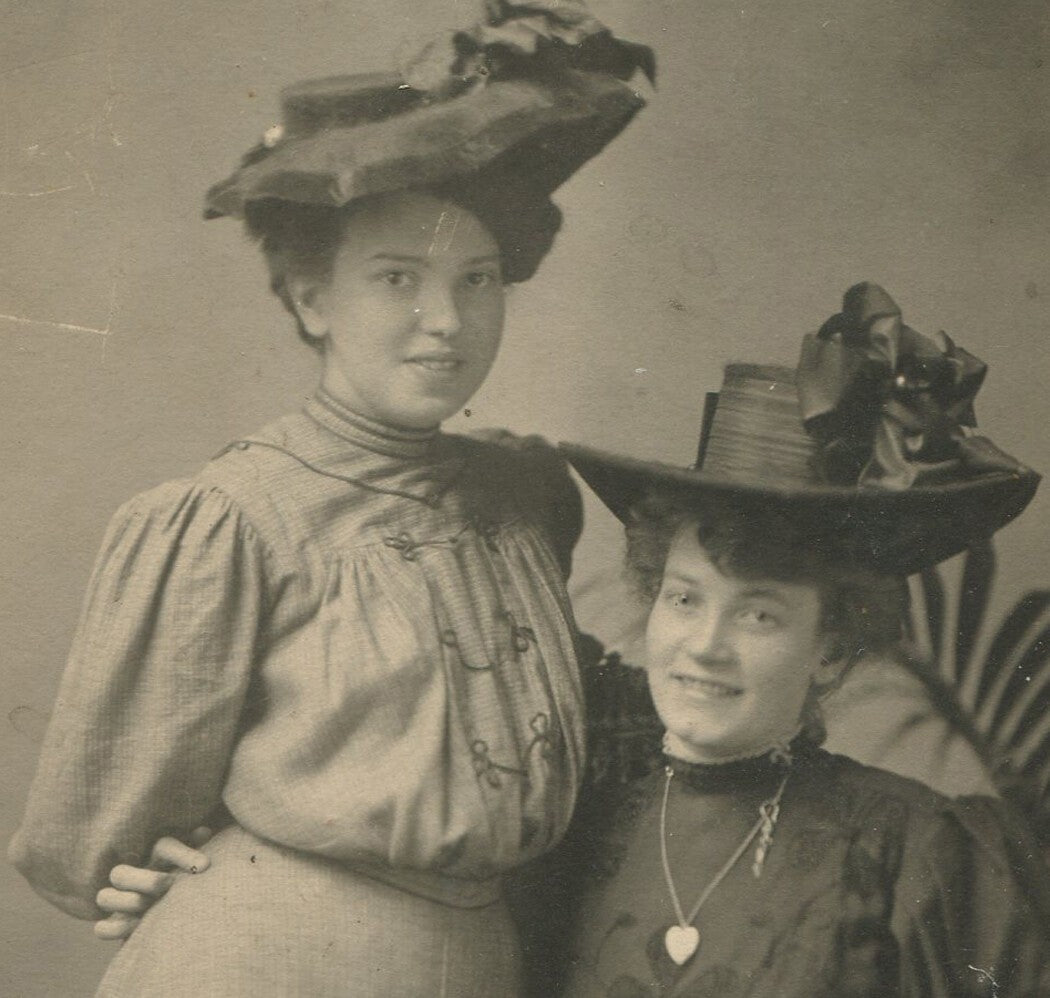 Vintage Black & White Photo: Two Women in Affectionate Pose, Mary Poppins Hats,