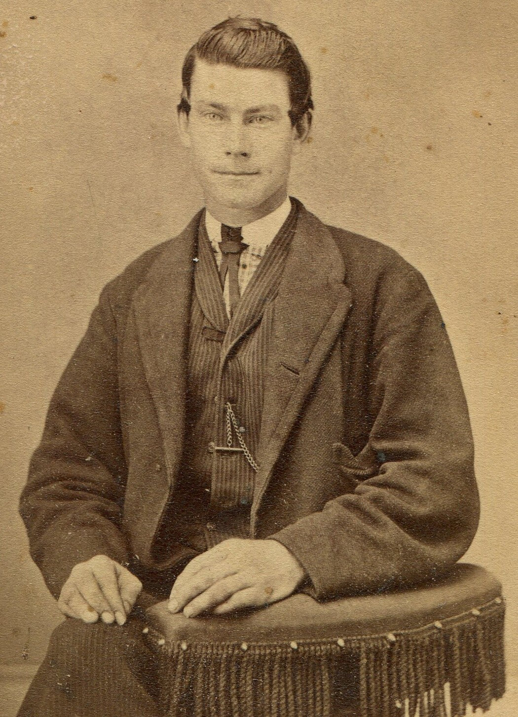 CUTE YOUNG MAN WITH IMPISH GRIN. CDV. MUSKEGON, MICHIGAN.