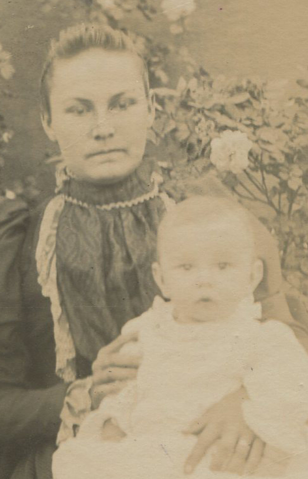 DAZED WOMAN WITH BABY, GARDEN SETTING. CABINET CARD.
