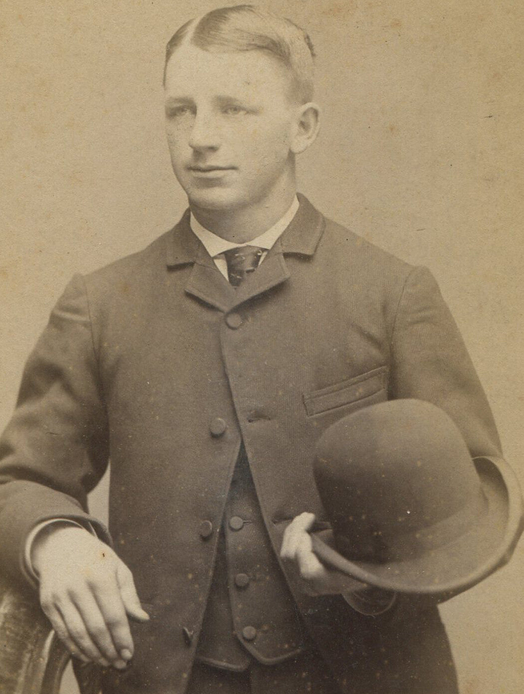 MAN HOLDING BOWLER HAT. CABINET CARD. BALTIMORE, MD.