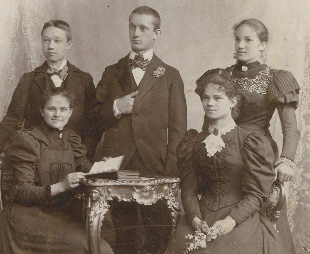 Rare authentic vintage cabinet card: finely dressed siblings around a table with