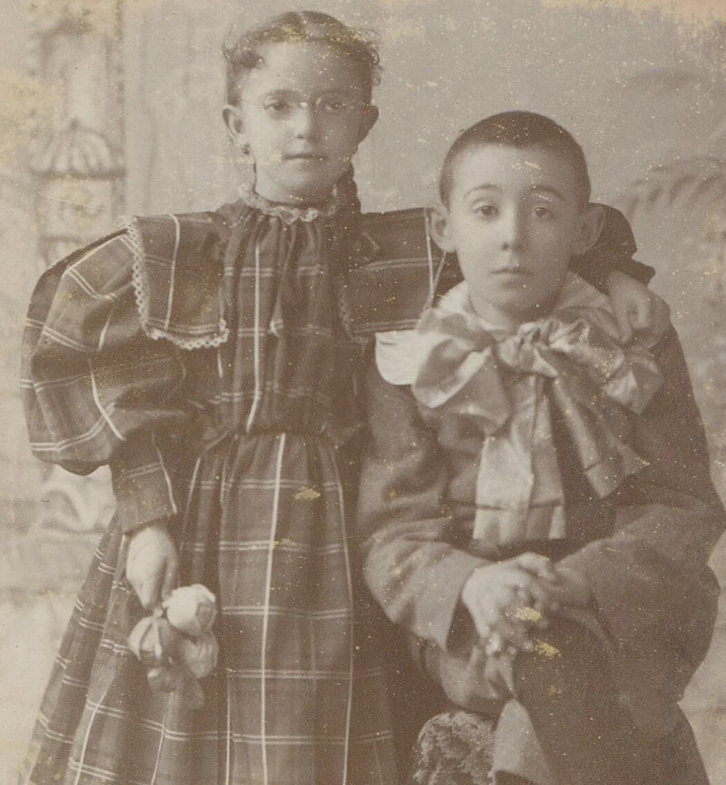 Vintage cabinet card Detroit siblings - girl with glasses, boy with surprised