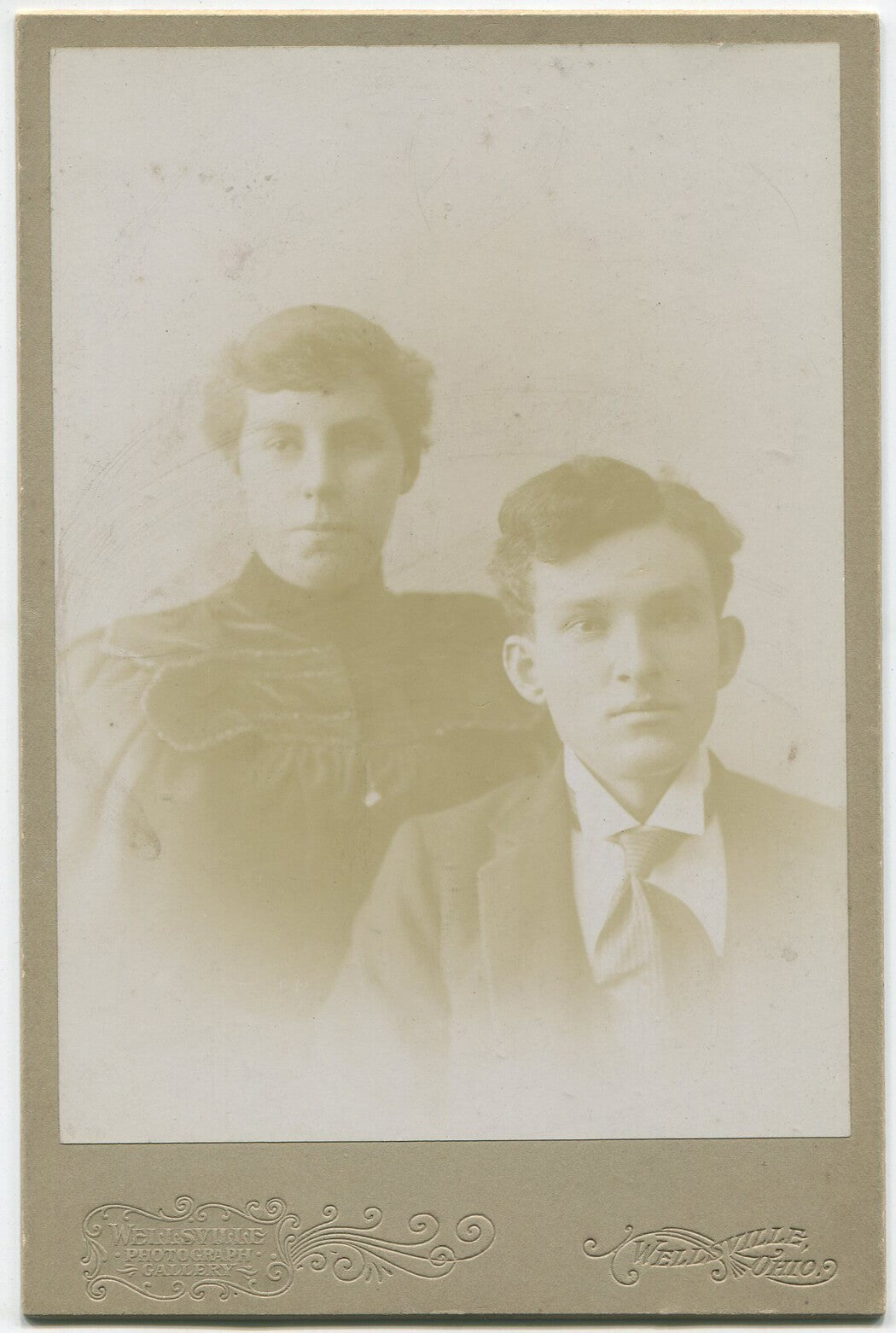 Vintage cabinet card portrait Wellsville, OH - couple with pursed lips and large