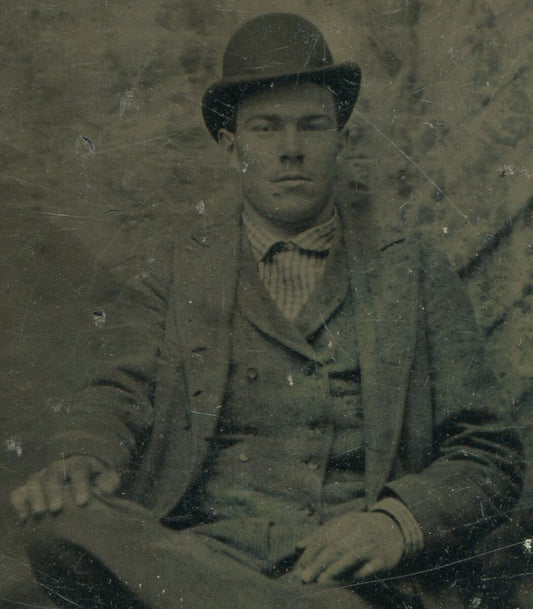 Vintage Tintype Portrait of Man in Hat, Cross-Legged Pose, Mean Expression