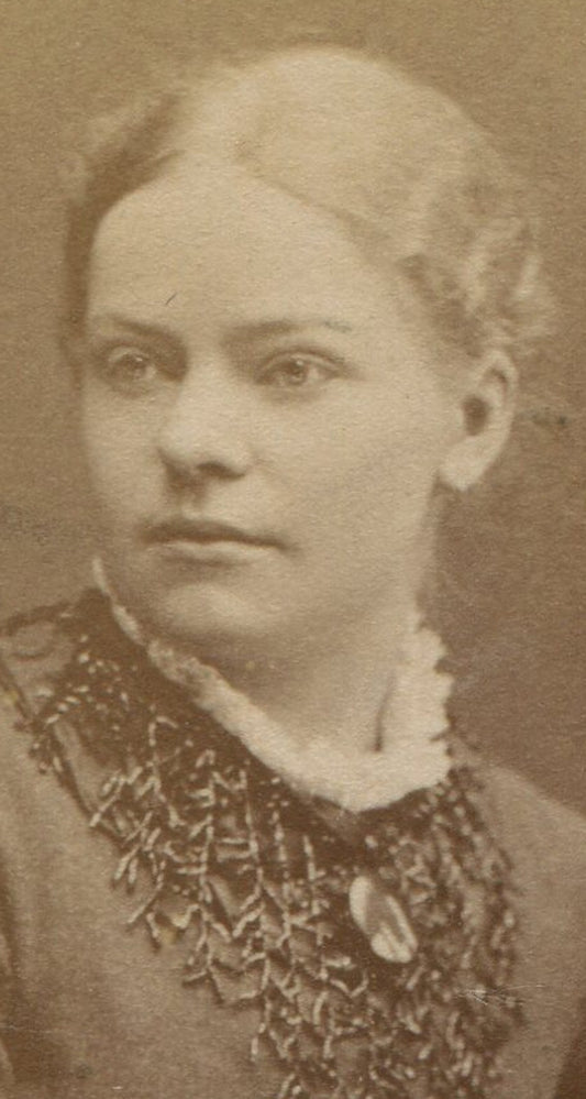 FINE FEATURED BEAUTY, HANDS RESTING ON TABLE. CDV. STOCKHOLM, SWEDEN.