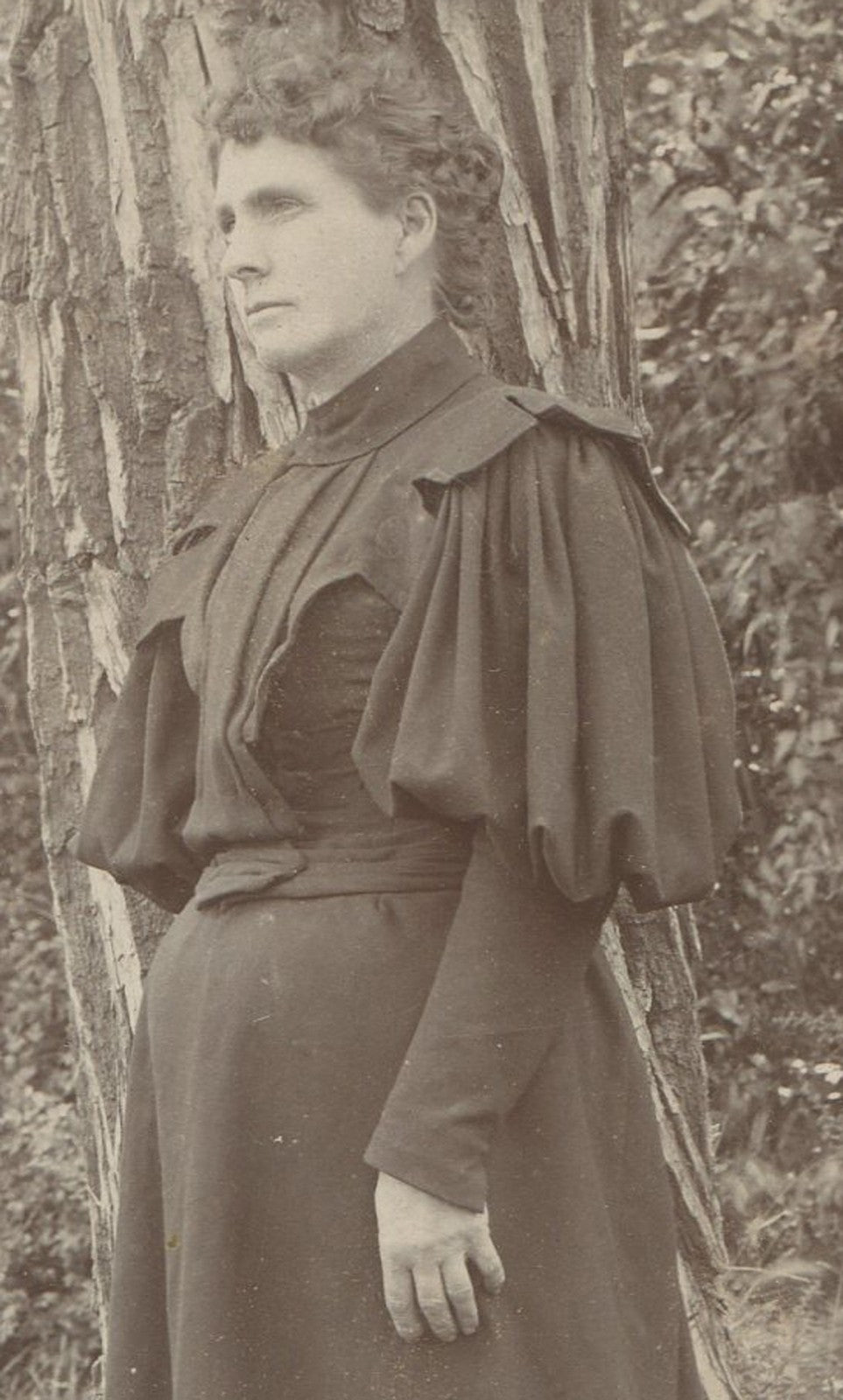 Vintage cabinet card portrait: Woman in dark dress in woods - haunting, eerie