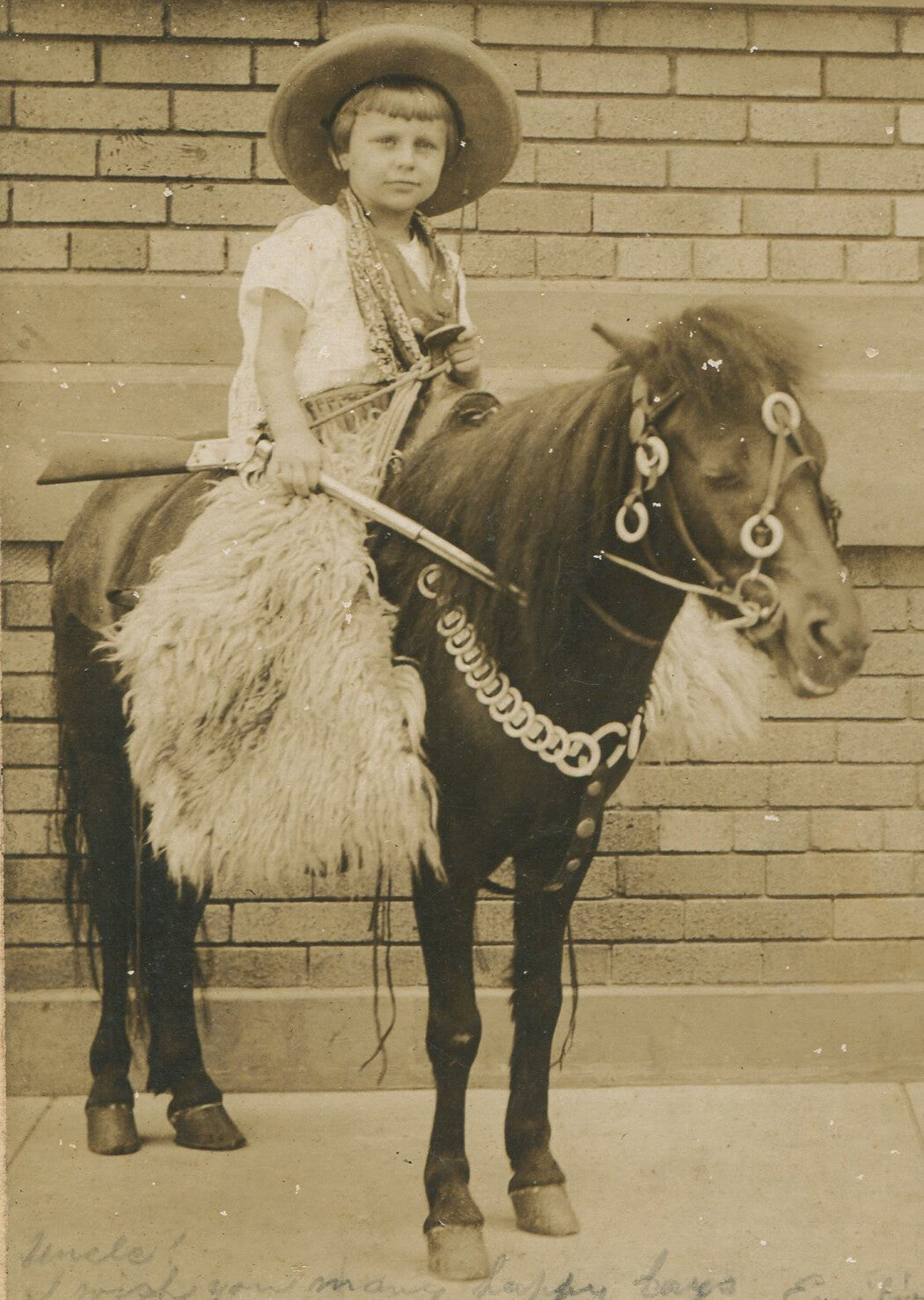 Vintage 1910s Silver Print Photo of Child on Pony with Fur Chaps, Hat and Gun -