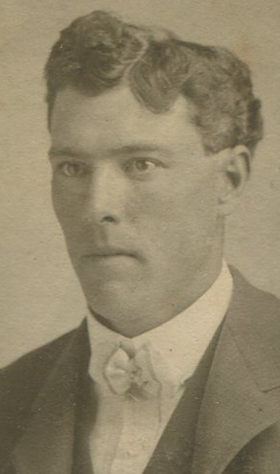 SLACK JAWED MAN, BEADED STAR CHAIN ON VEST. OVAL PHOTO.