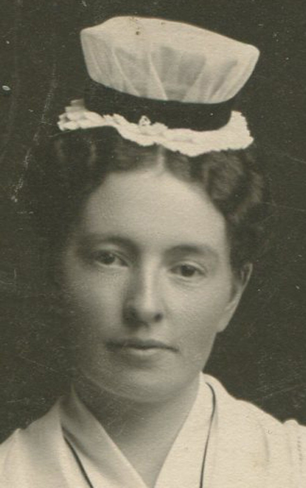 Vintage nursing graduate cabinet card portrait holding book, Toledo, Ohio photo
