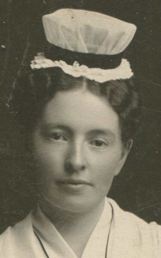 Vintage nursing graduate cabinet card portrait holding book, Toledo, Ohio photo