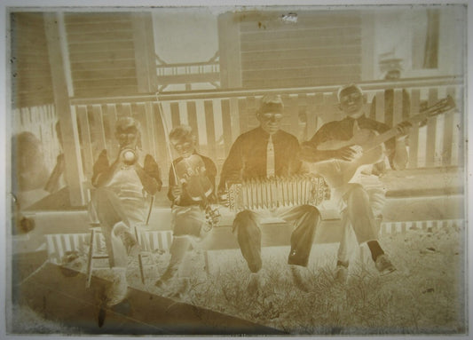 FAMILY OF MUSICIANS PLAYING ON THE PORCH. 5X7 GLASS PLATE NEGATIVE.