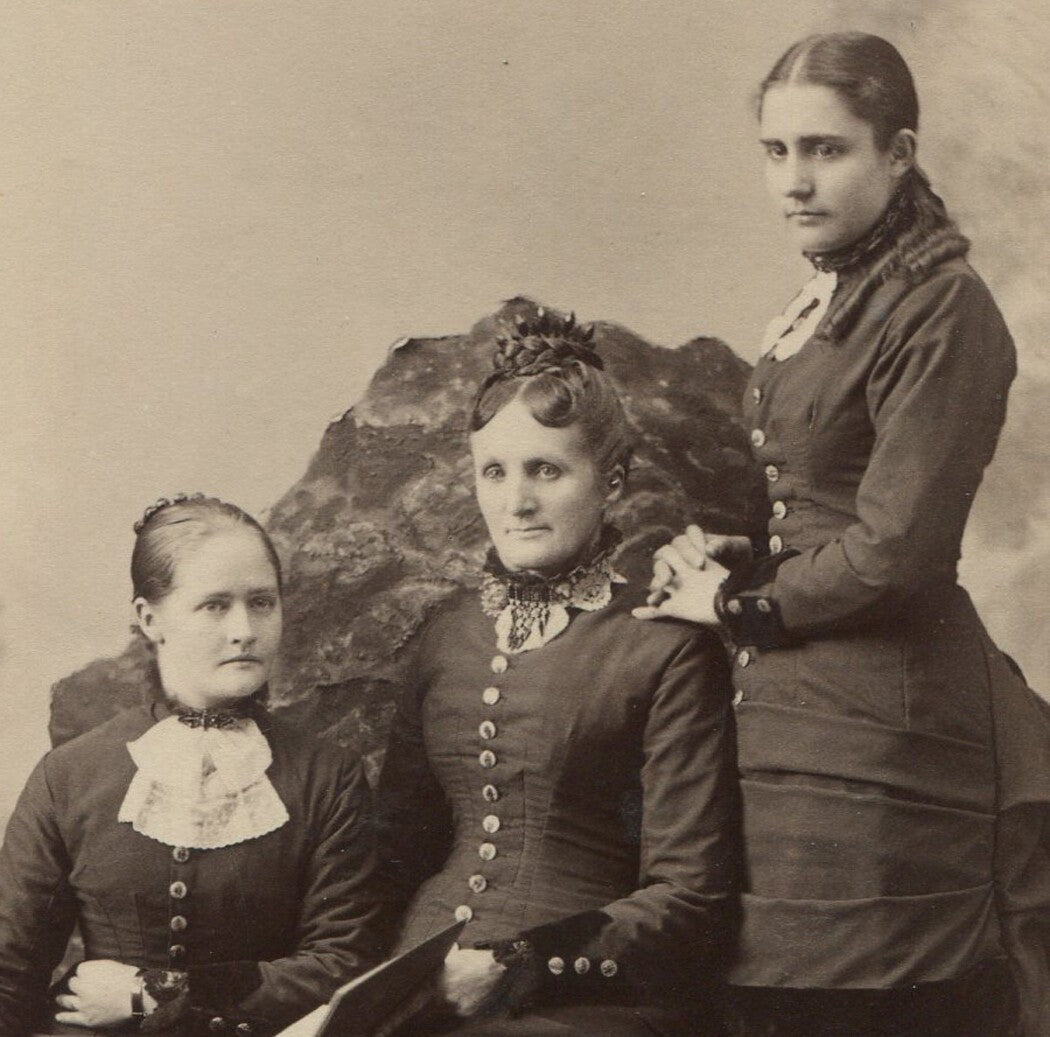 Vintage cabinet card: mother with two daughters, eerie cult vibe, curious gazes,