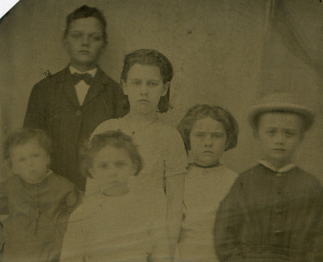 SIX UNHAPPY CHILDREN POSE FOR LOVING PARENTS. TINTYPE.