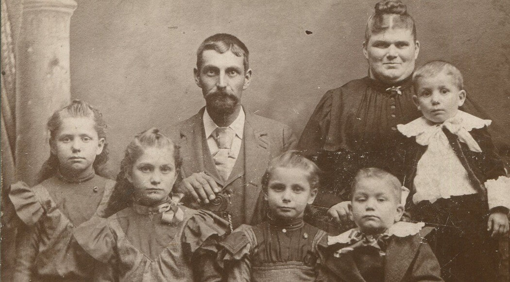 Vintage cabinet card portrait: Parents with five handsome children, early family