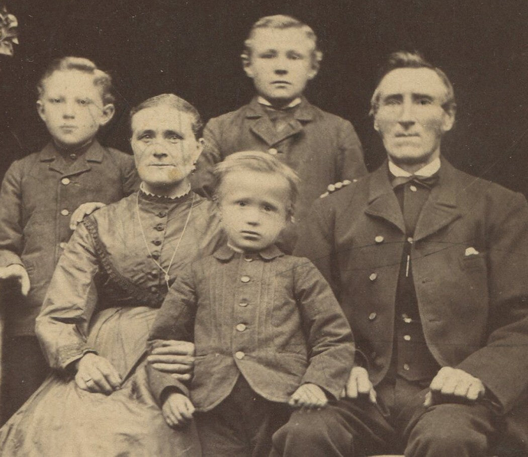 Vintage cabinet card photo: family portrait with three boys, exterior shot,