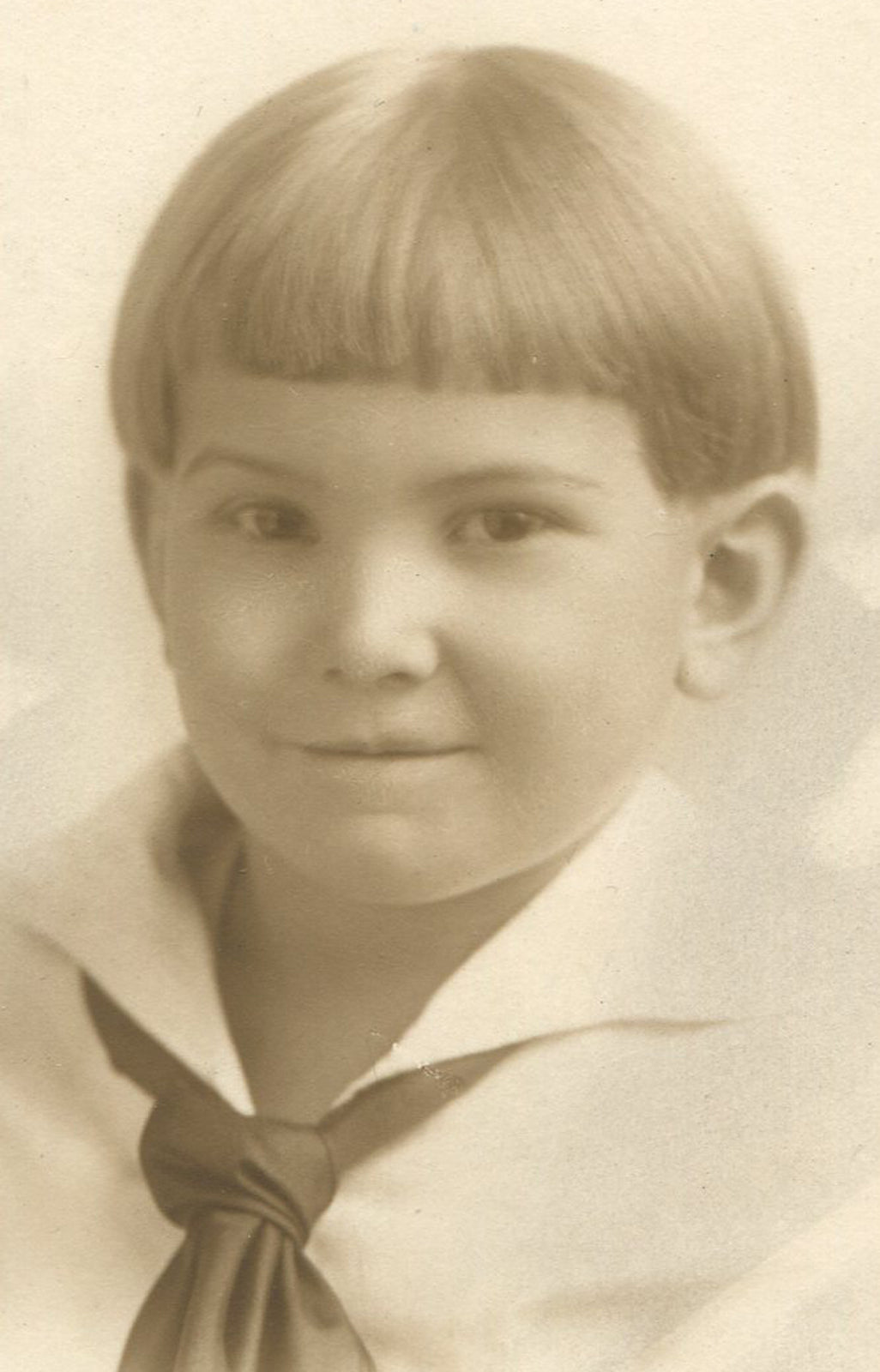 CHILD W/SEVERE HAIRSTYLE. TONED PRINT IN FOLDER. 6 X 4 INCH PRINT.