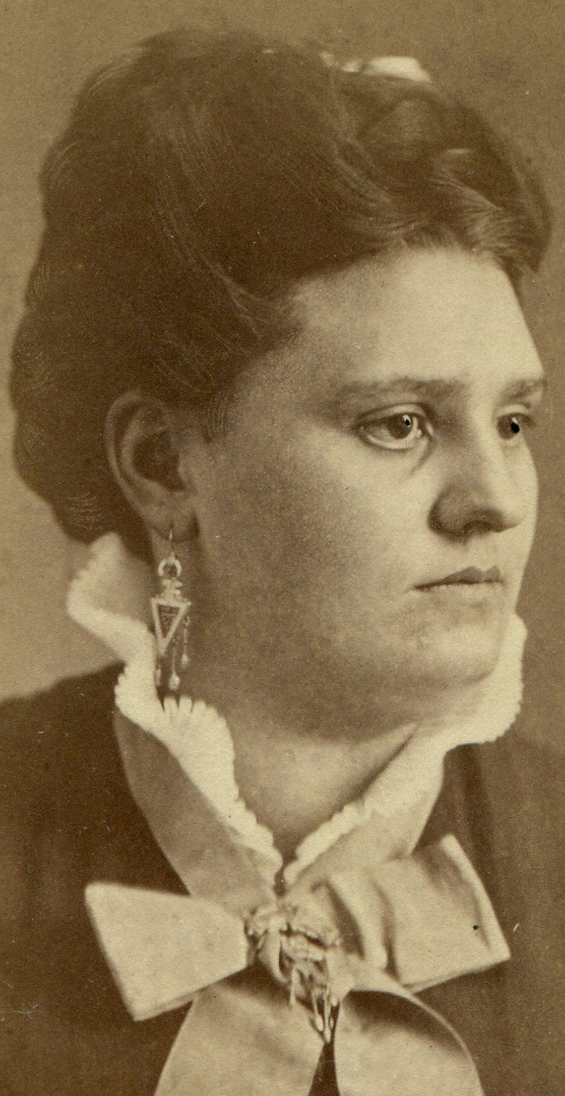 WOMAN, PROFILE POSE, LONG EARRINGS, HIGH COLLAR. DRAMATIC. CDV. FRAMINGTON, ILL.