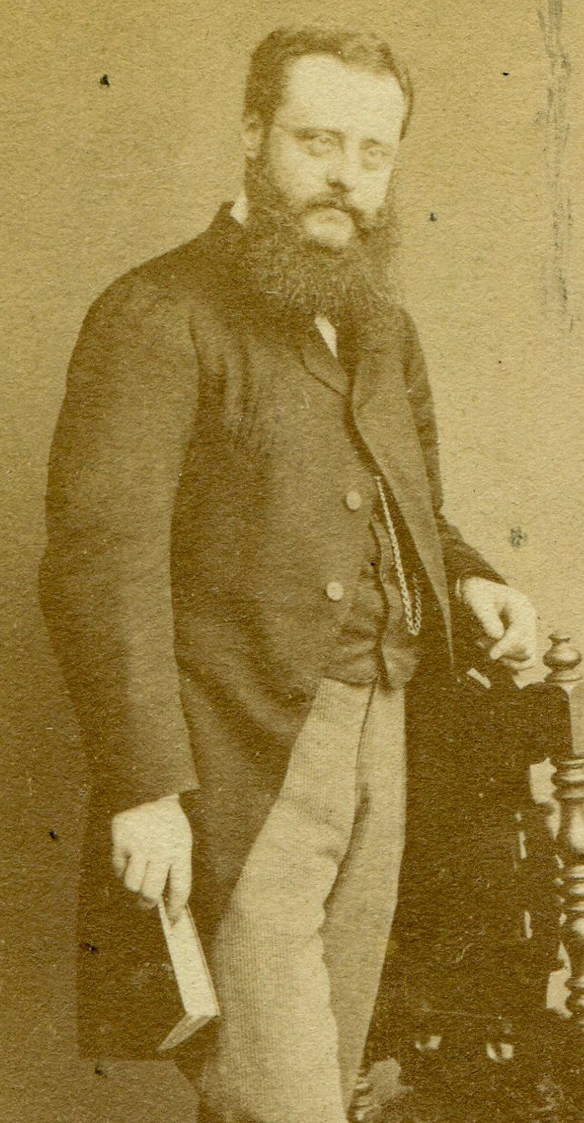 BEARDED MAN POSED HOLDING BOOK. CDV. LONDON, ENGLAND.