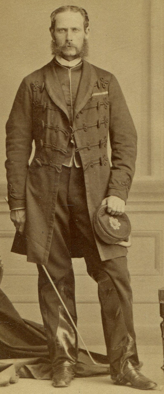 MAN IN ORNATE LONG COAT, KEPI, RIDING CROP, LEATHER TRIMMED PANTS. CDV. MONTREAL
