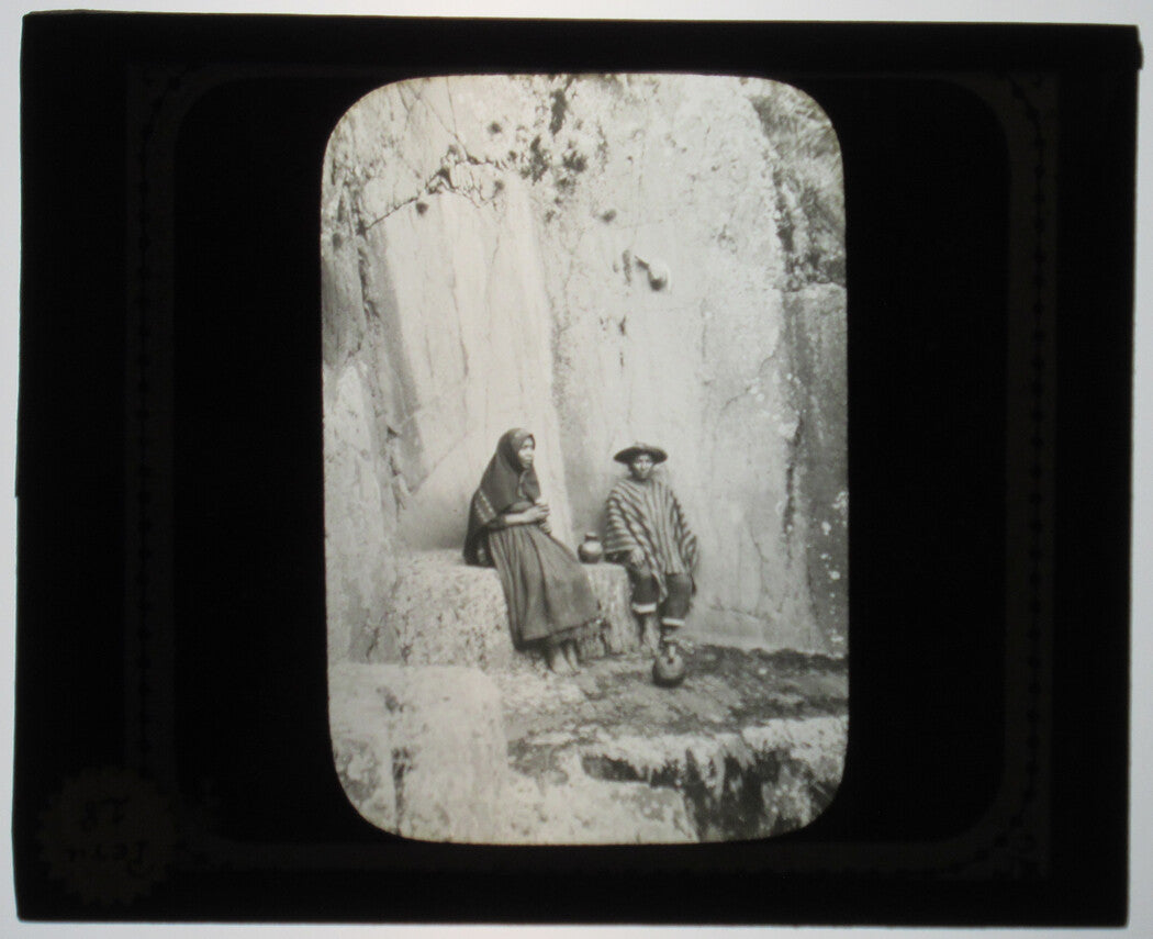 INDIGENOUS PERUVIAN COUPLE AT LEISURE. PHOTO ON GLASS.