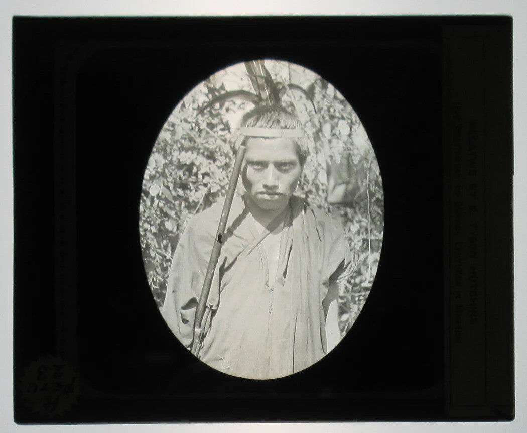 INDIGENOUS PERUVIAN MAN CARRYING A YUCCA. PHOTO ON GLASS.