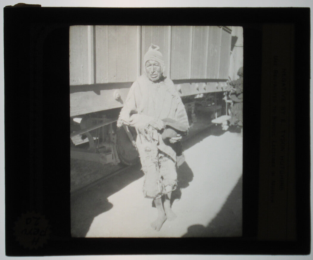 INDIGENOUS MAN BY RAILROAD CAR. PERU. PHOTO ON GLASS.