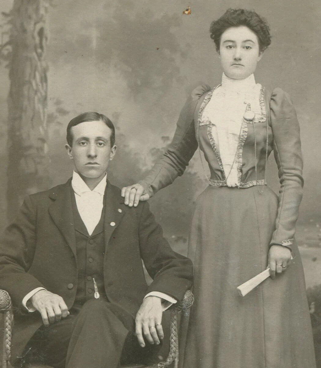 COUPLE, AFFECTIONATE POSE. WOMAN HOLDING FOLDED FAN. CABINET CARD.