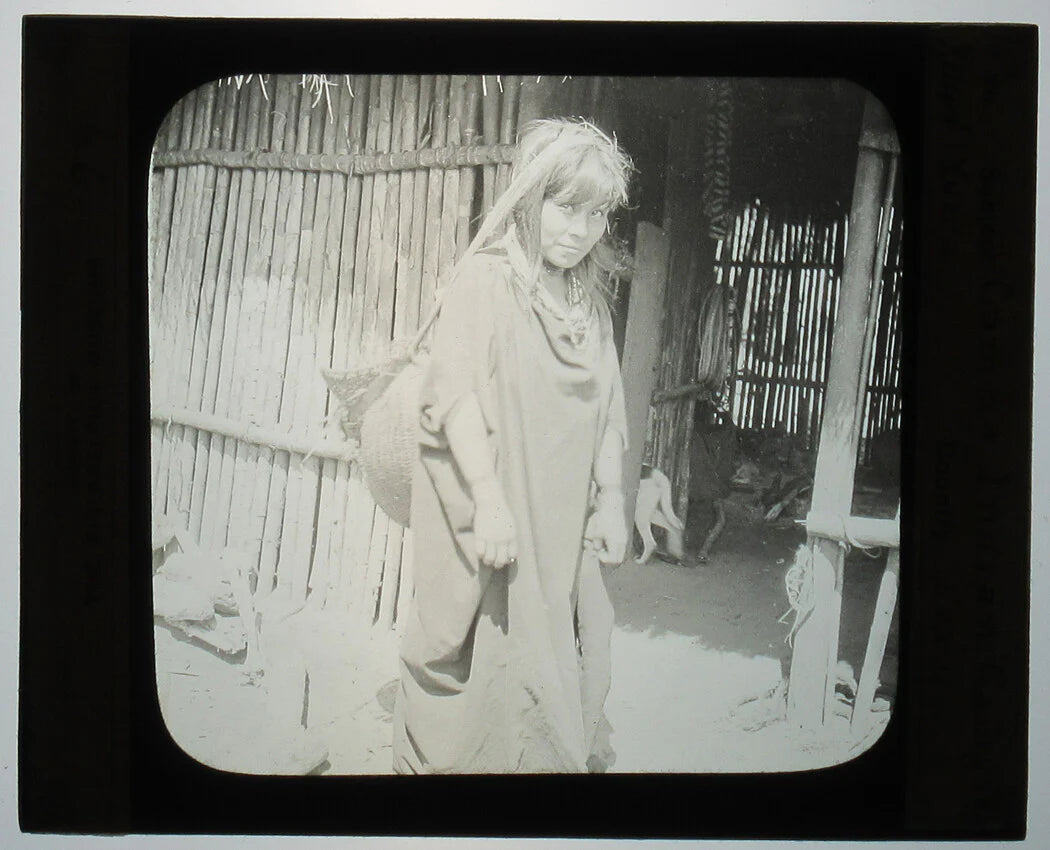 YOUNG INDIGENOUS WOMAN CARRYING YUCCA. PERU. PHOTO ON GLASS.