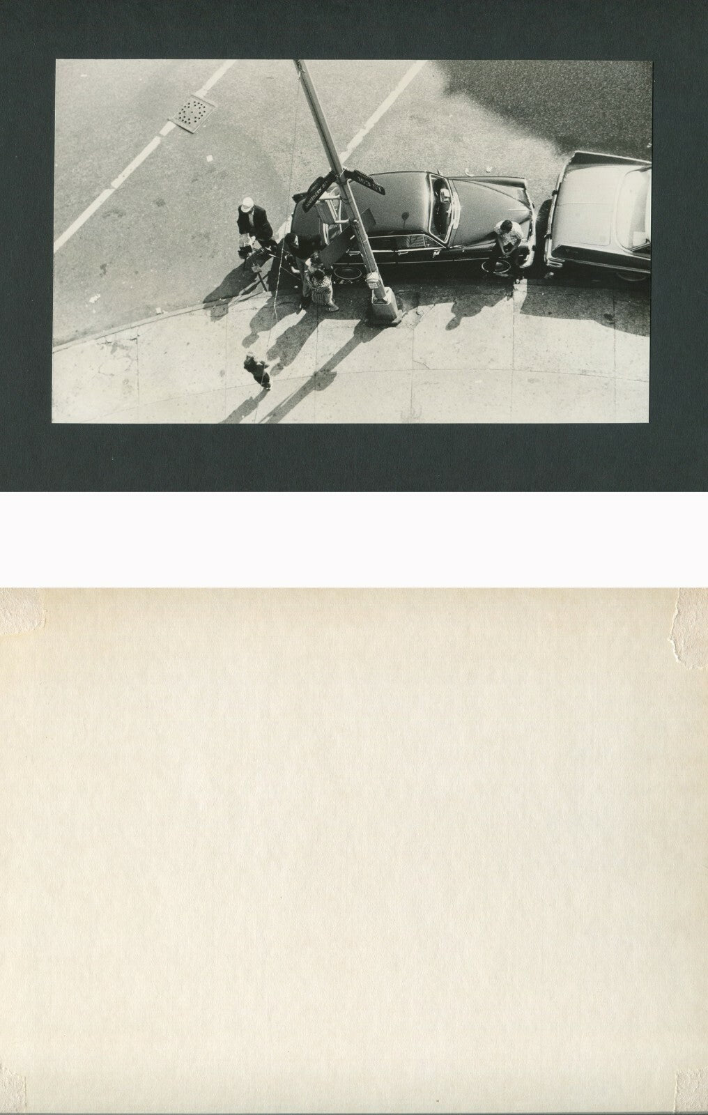 LOOKING DOWN ON PHOTOGRAPHER TAKING PHOTO AT SOUTHERN BLVD AT 163 ST,BRONX, N.Y.
