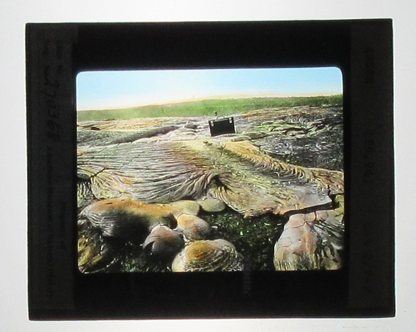 KILAUEA LAVA FLOW. HAND COLORED PHOTO ON GLASS.