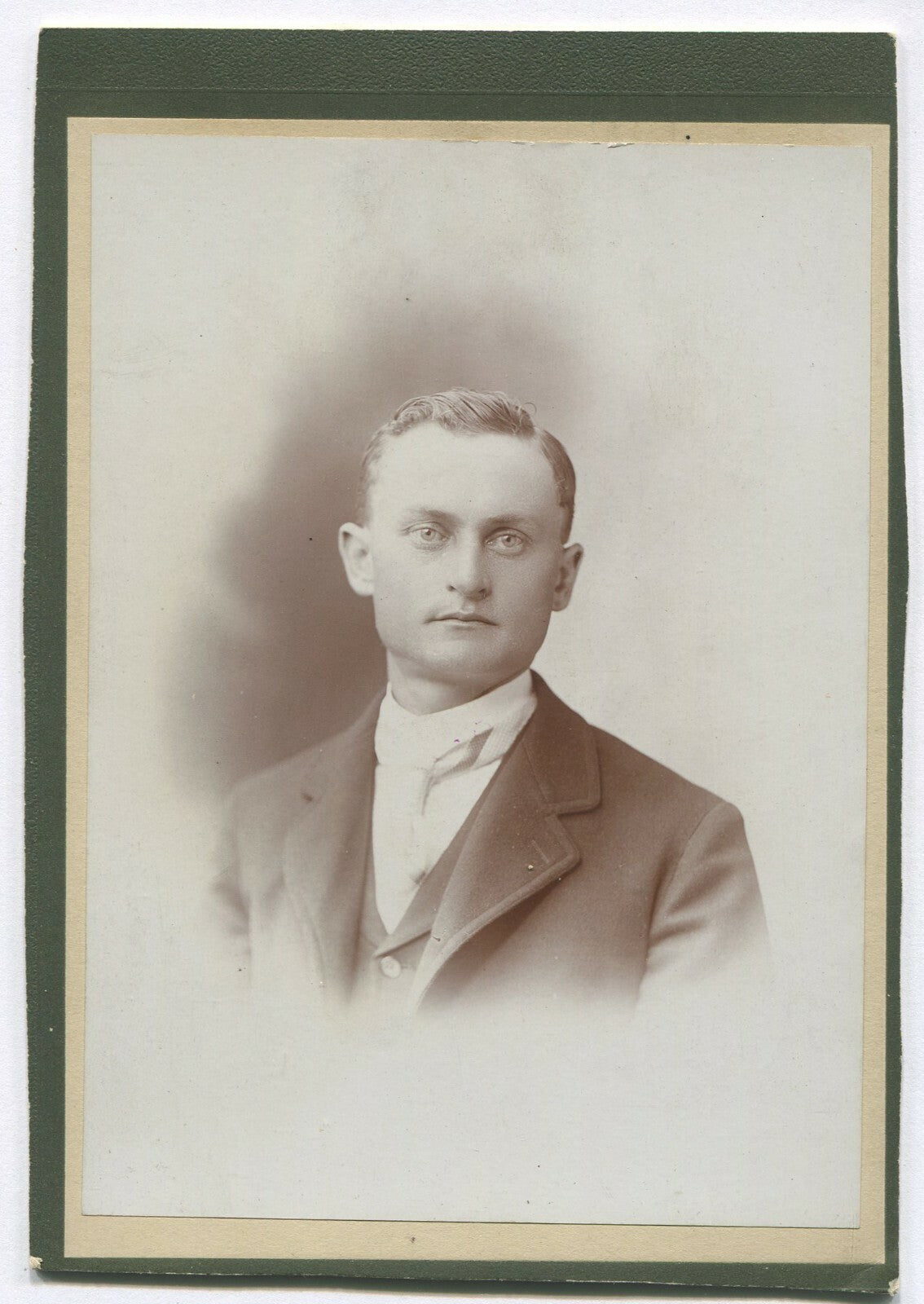 SQUARE JAWED MAN. 1920s PHOTO ON TRIMMED CARD.