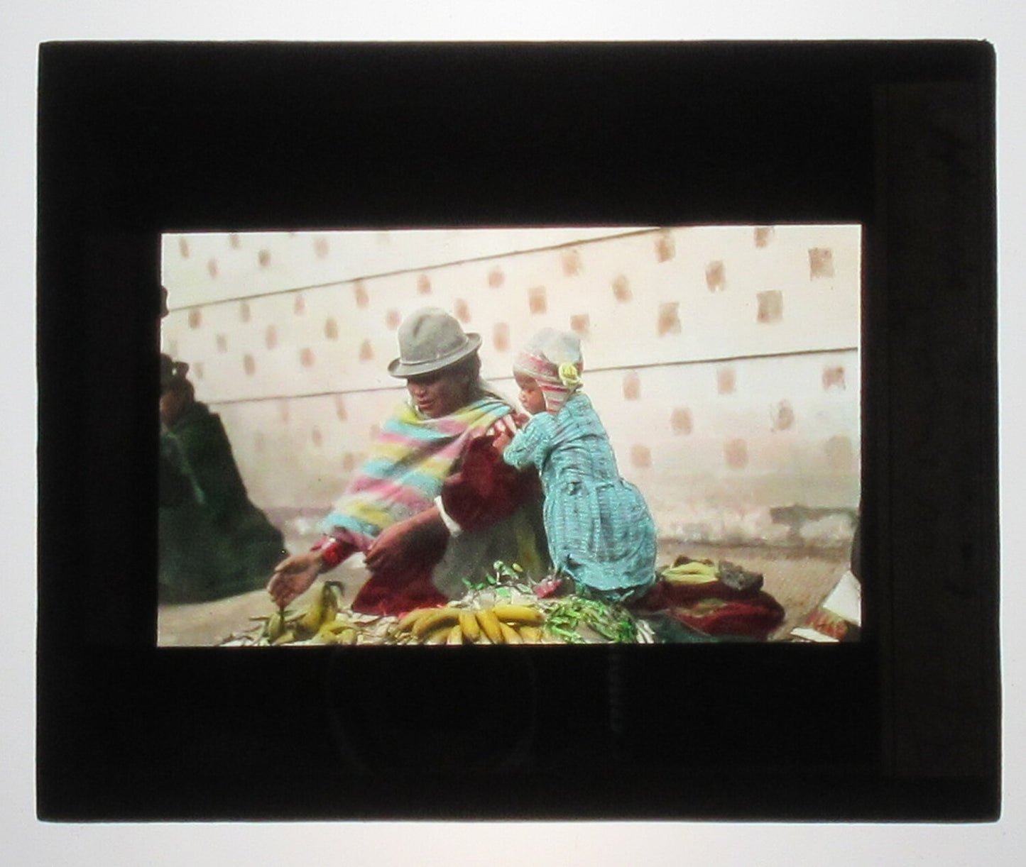 PERUVIAN WOMAN W/CHILD. HAND COLORED PHOTO ON GLASS. TINTED LANTERN SLIDE.