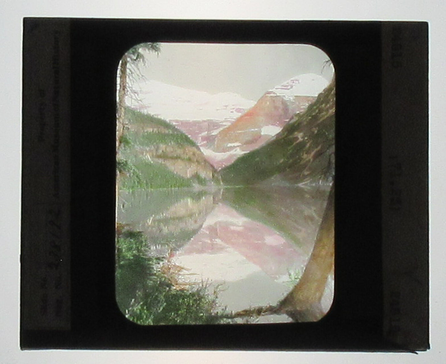 LAKE LOUISE. ALBERTA, CANADA. HAND COLORED PHOTO ON GLASS. TINTED LANTERN SLIDE