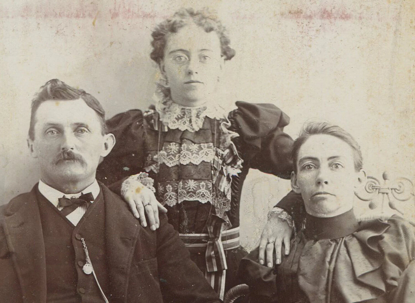 PARENTS POSED W/OVERBEARING DAUGHTER. GREAT DRESSES. CABINET CARD.