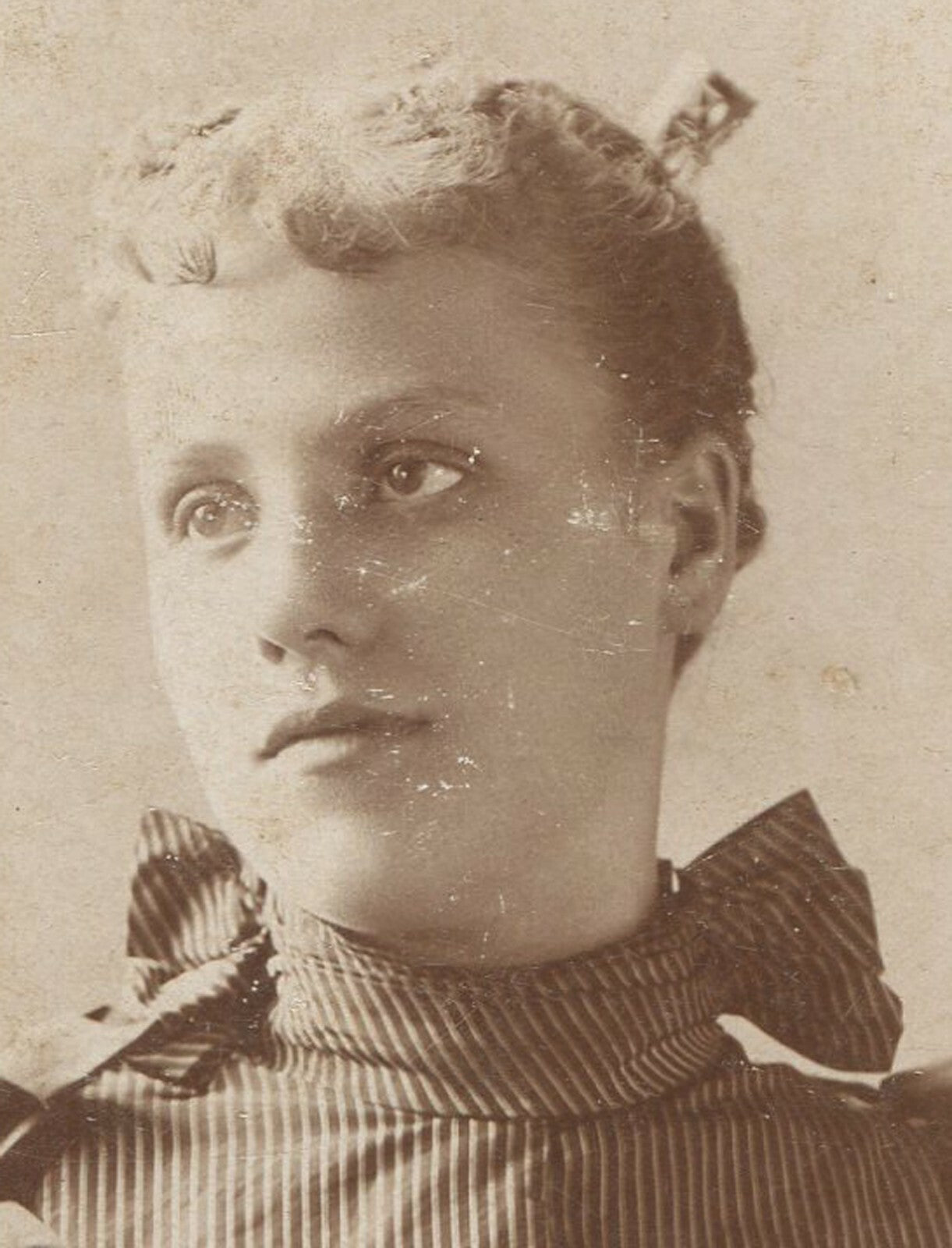 Vintage cabinet card photo: young woman in striped dress, antenna on head, early