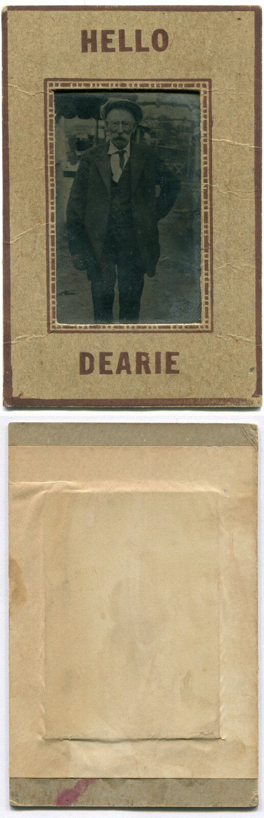 OLDER MAN W/MUSTACHE, HAT. 3.5X2.5 INCH TINTYPE IN HELLO DEARIE PAPER MAT.