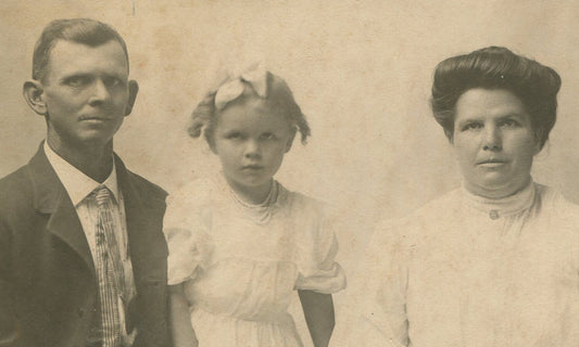 Vintage family portrait: Parents with daughter - 3.75x5.5 silver print on 6x8