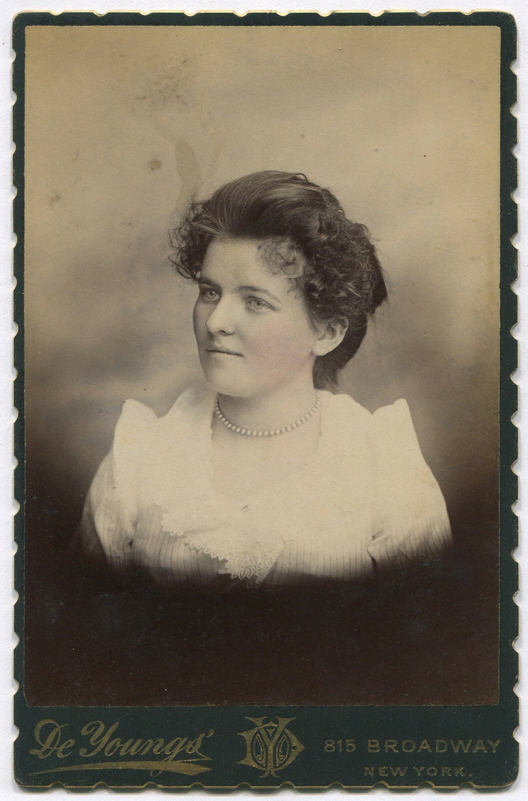 Vintage cabinet card portrait of a woman with pearl necklace, tinted New York