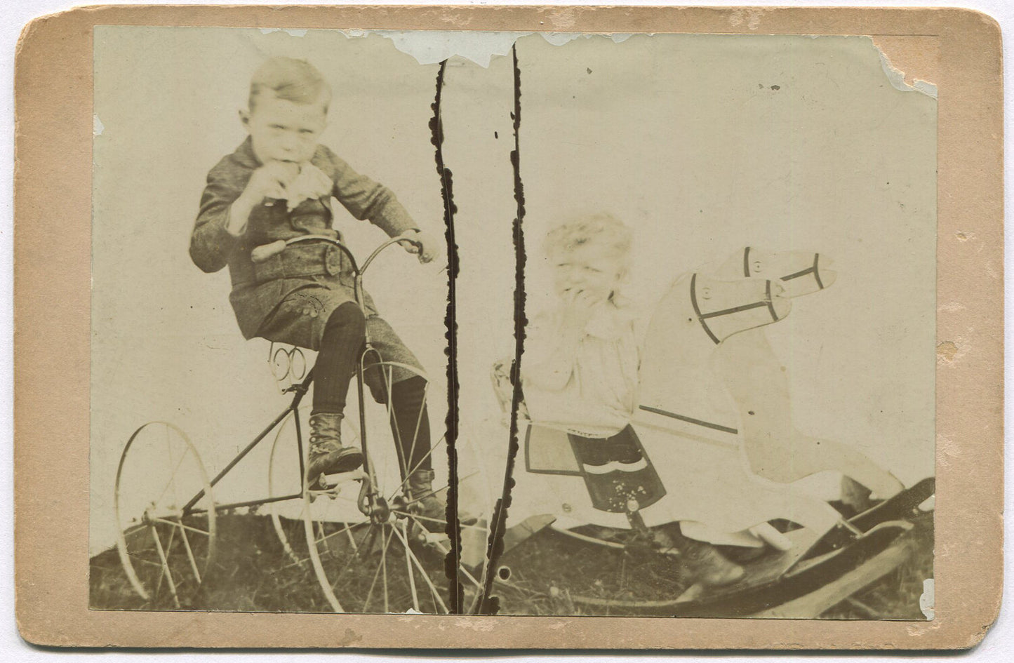 CHILDREN W/ TRICYCLE AND DOUBLE ROCKING HORSE. CABINET CARD.