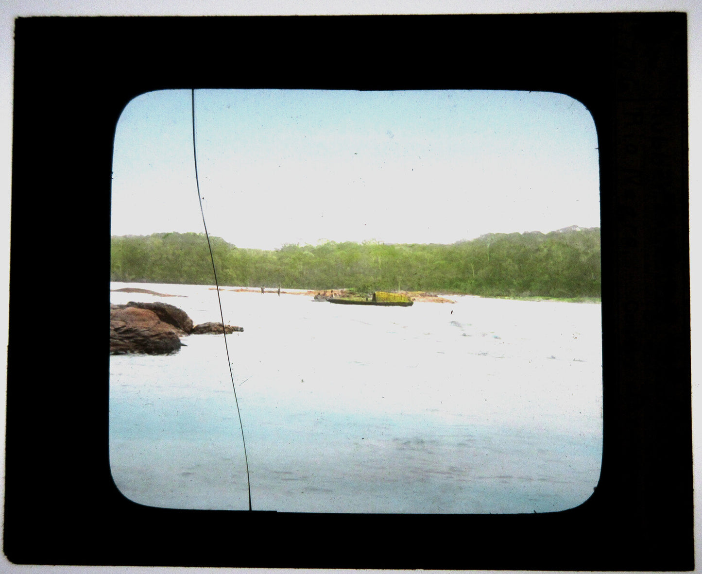 COLLECTING RUBBER. BRAZIL. HAND COLORED PHOTO ON GLASS.
