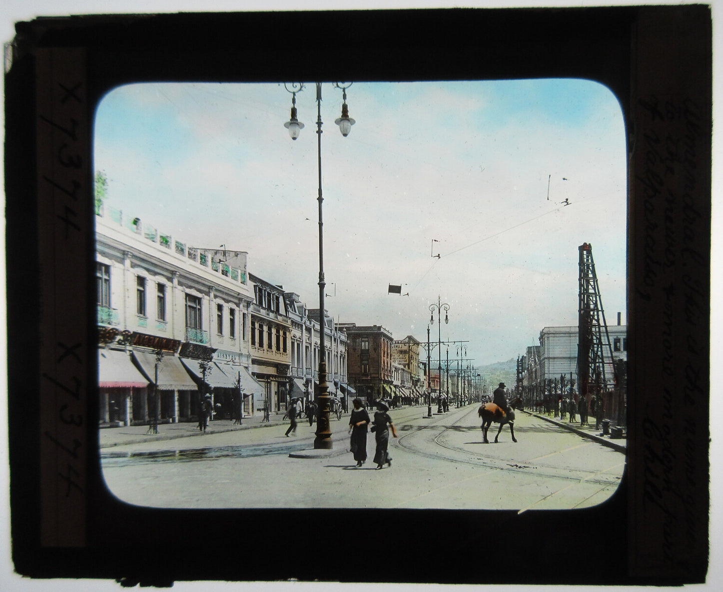 STREET SCENE, VALPARAISO, CHILE. 1900. HAND COLORED PHOTO ON GLASS.
