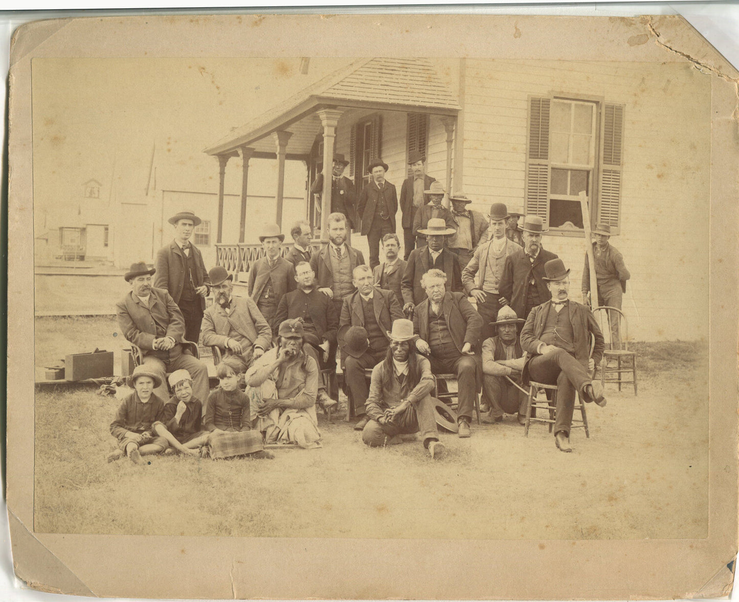 NATIVE AMERICANS AND WHITE PEOPLE POSE OUTSIDE HOUSE. 6.5X9.24 ALBUMEN