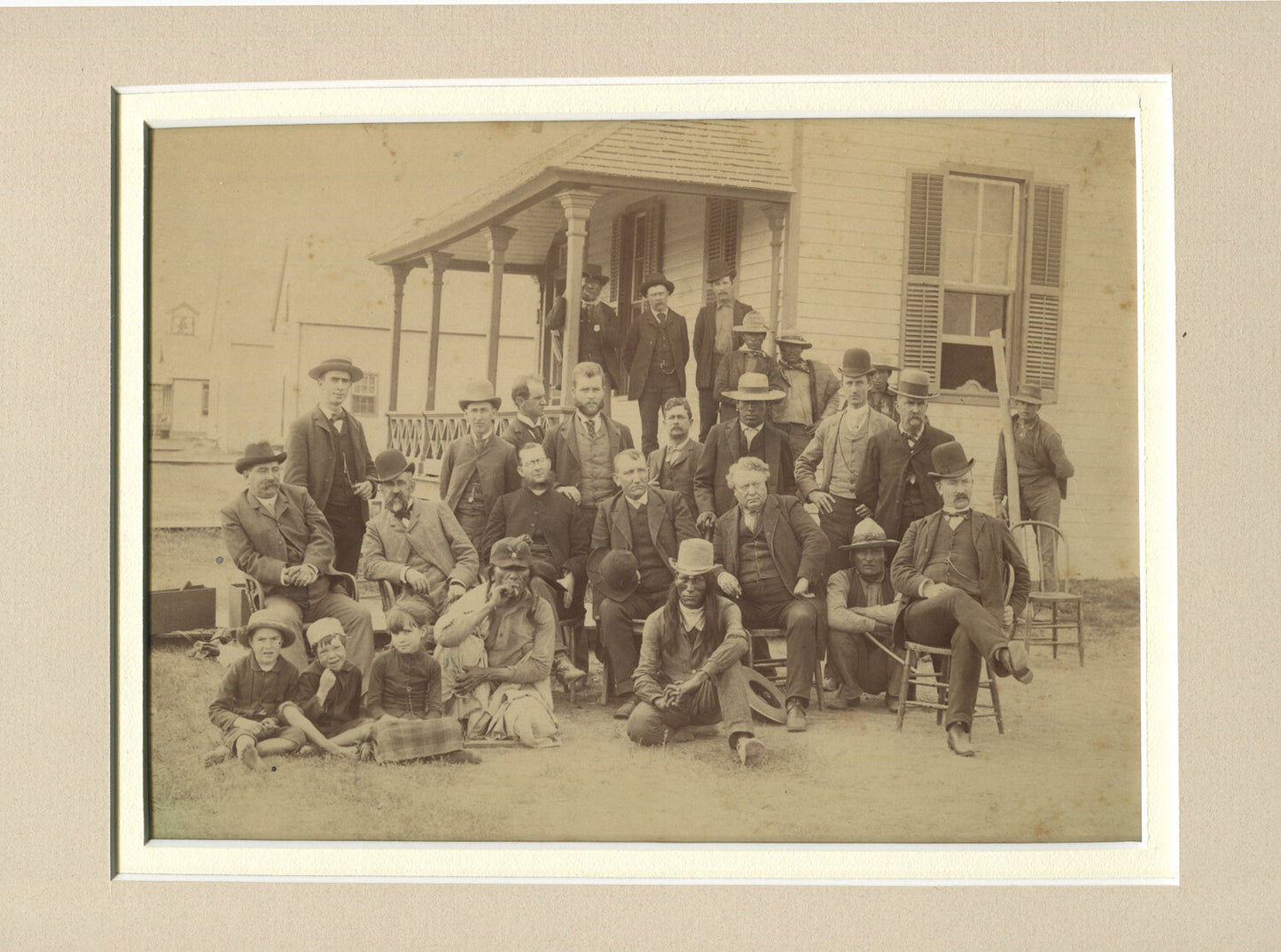 NATIVE AMERICANS AND WHITE PEOPLE POSE OUTSIDE HOUSE. 6.5X9.24 ALBUMEN