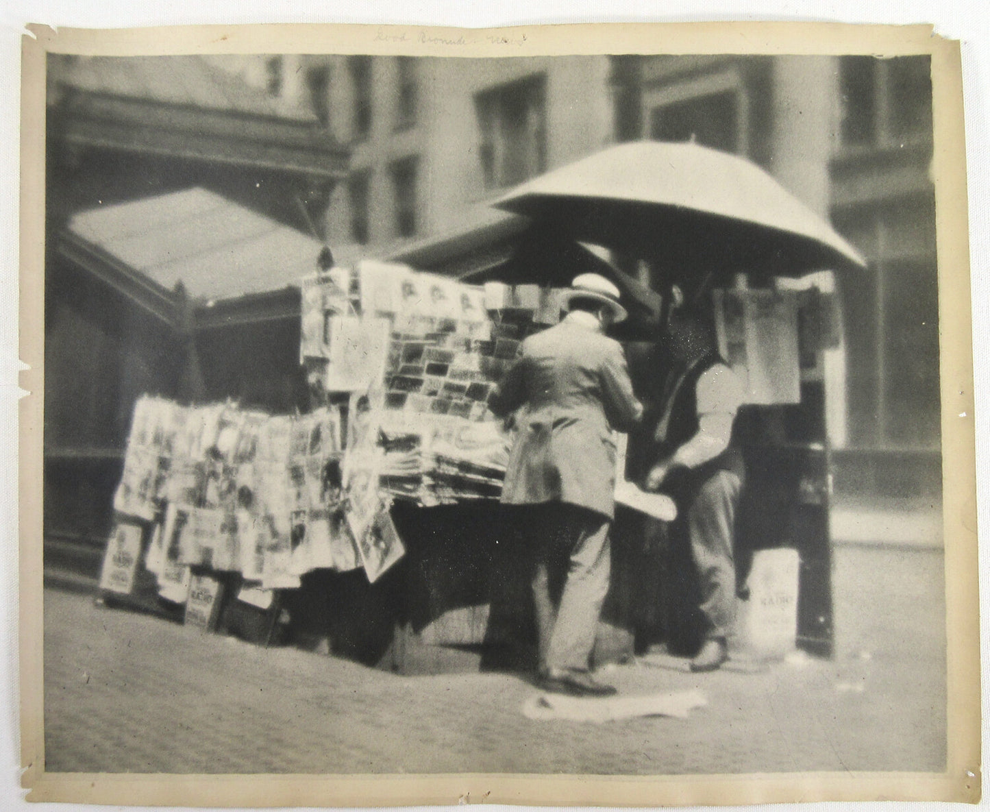 STREET SCENE, NEWS STAND, 1920s. PICTORIALISM, 14X16.5 B&W FIBER.