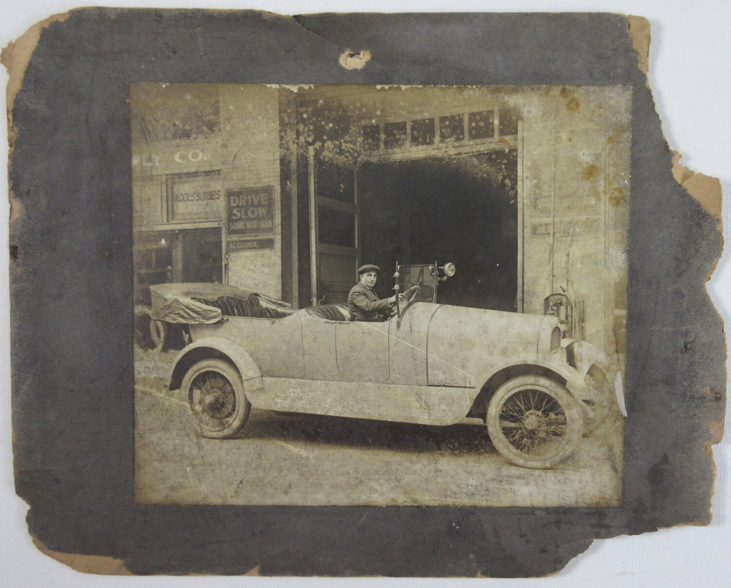 EARLY MODEL CAR W/DRIVER/TOP DOWN. 8X9.5 PHOTO ON 11X13.5 CARD.