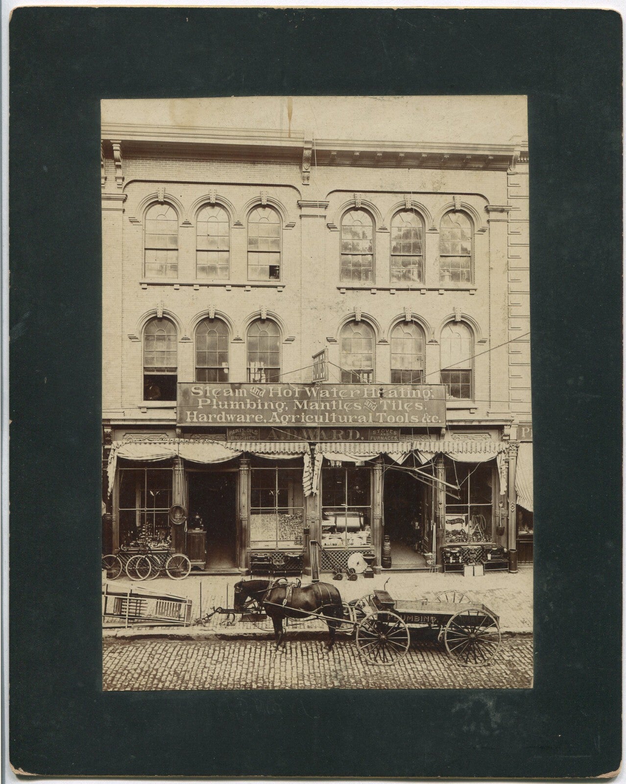 STREET VIEW, HARDWARE STORE. ALBUMEN PHOTO, 7.75X5.5 INCH/8X10 CARD.