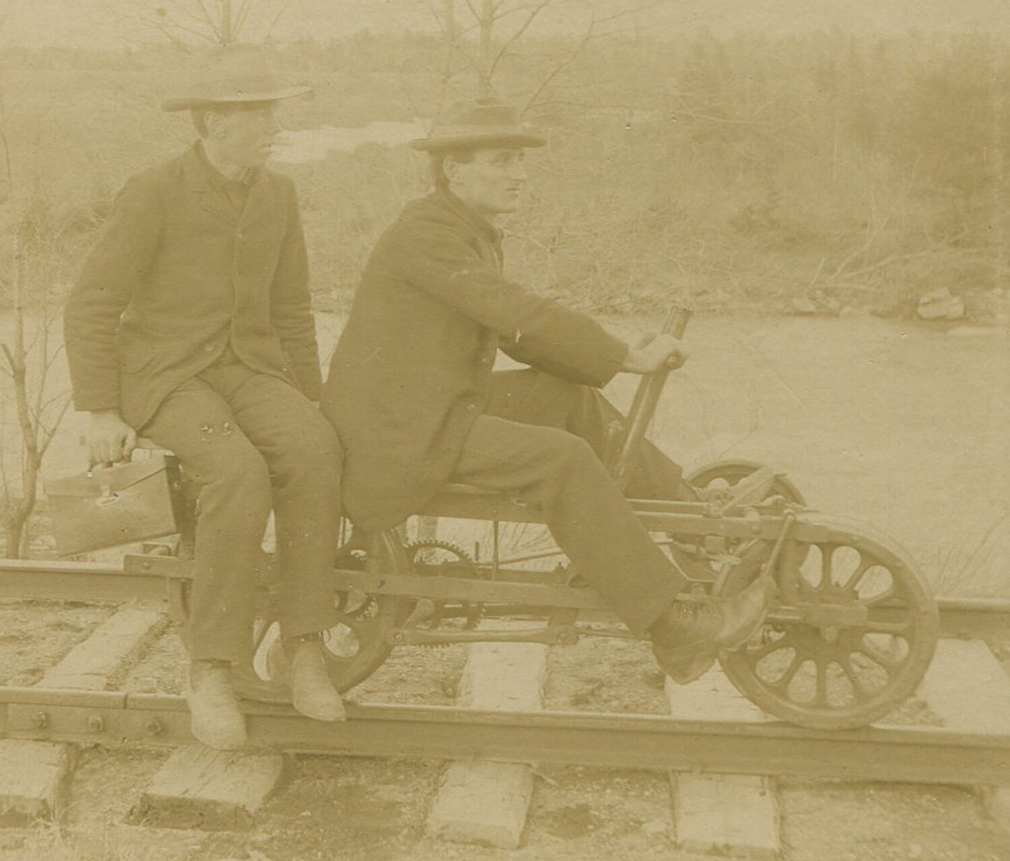 Vintage cabinet card photo: Men on railroad pedal car with photographic