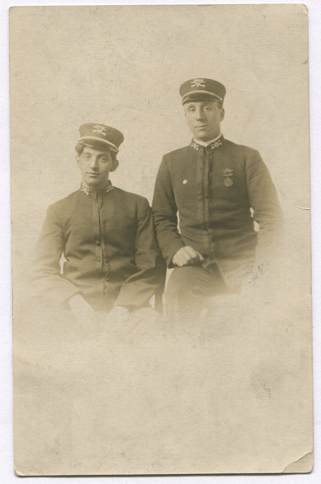 Vintage military postcard - men in uniform with hat insignia, original photo,