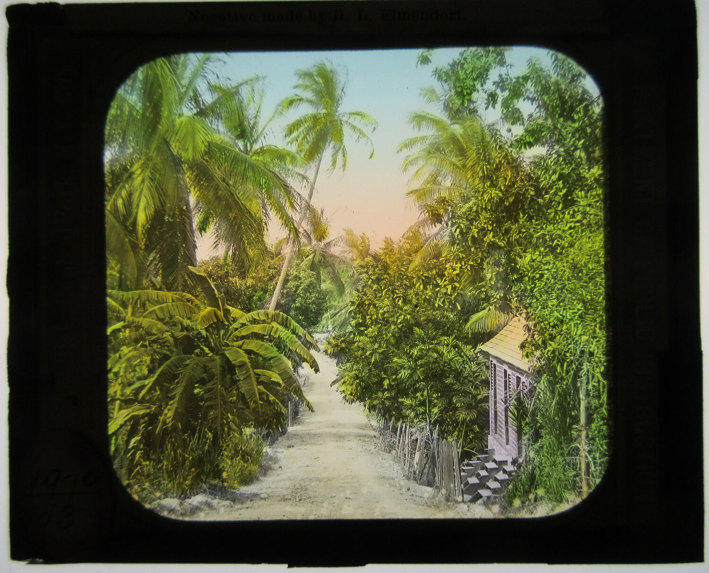 SMALL COTTAGE ON RURAL LANE, TROPICAL SETTING. TINTED LANTERN SLIDE.